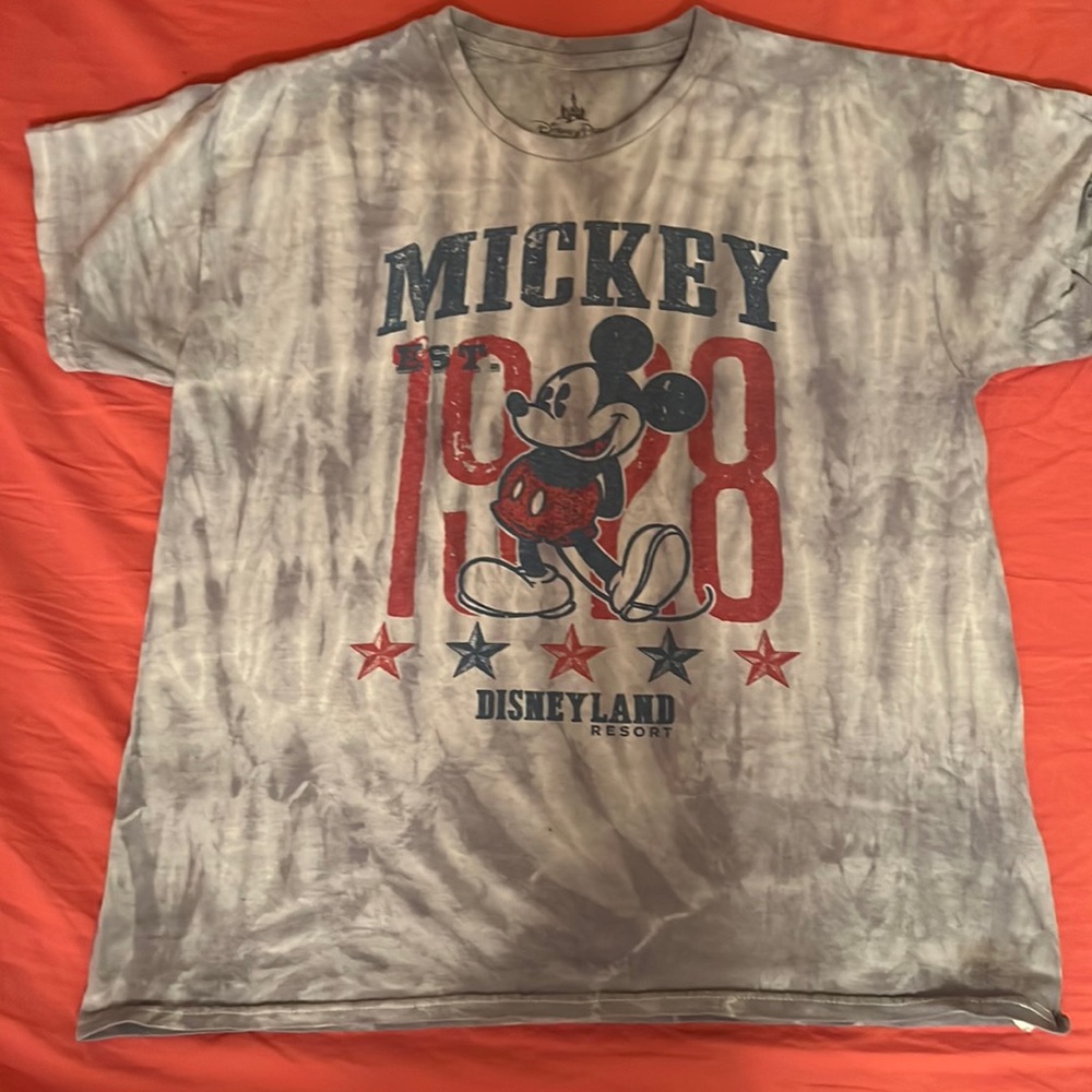 A never worn shirt . Has Mickey Mouse 1928 on it .